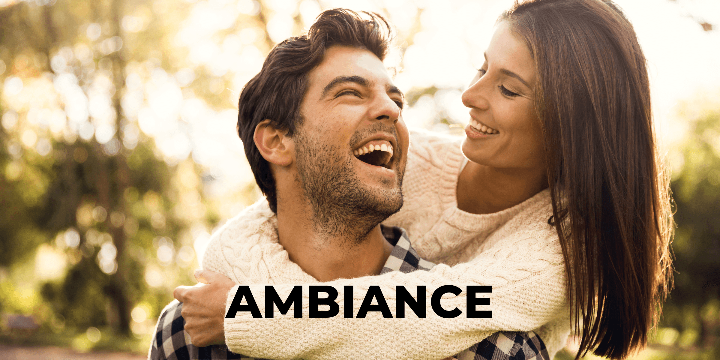 Woman hugging man from behind as they laugh and have a good time after using the Ambiance matchmaking service.
