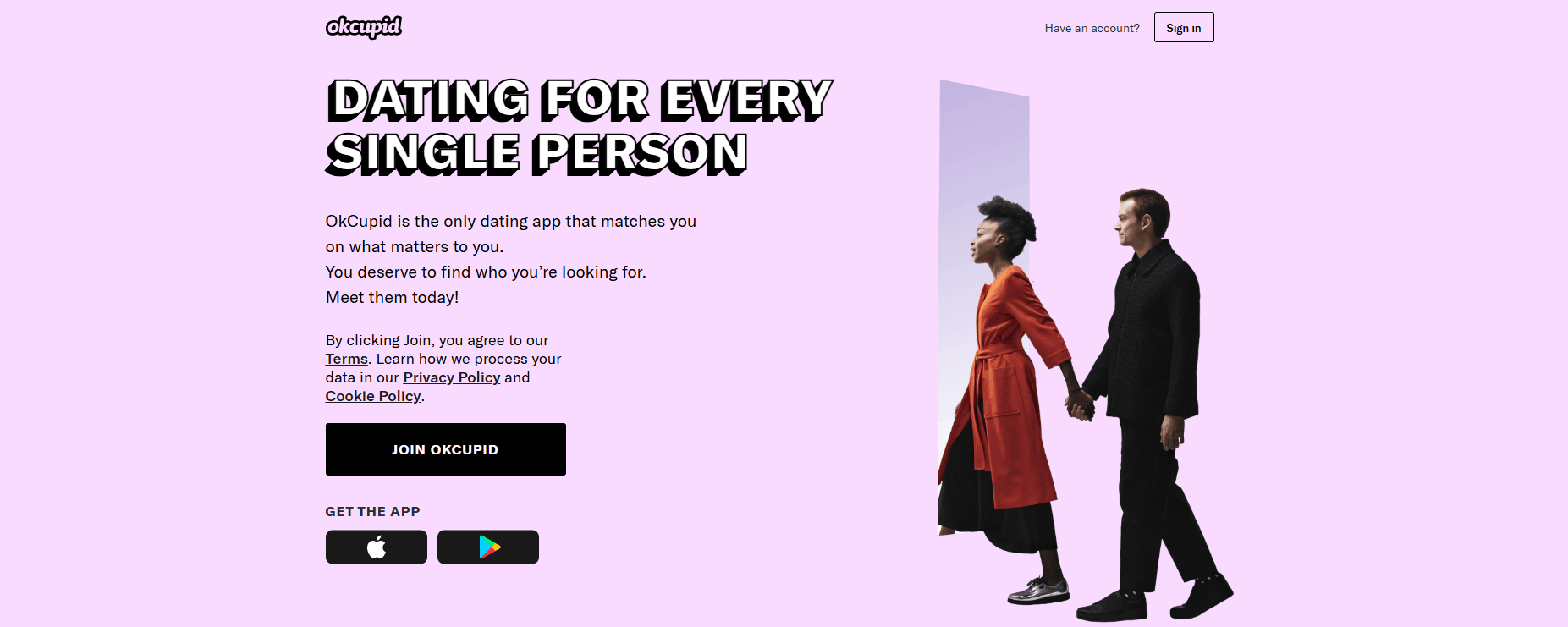 OkCupid homepage with the headline "Dating for every single person" and a couple holding hands on a pink background