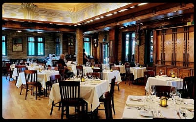 Dining room at North Pond restaurant in Lincoln Park with white-clothed tables and warm wood details